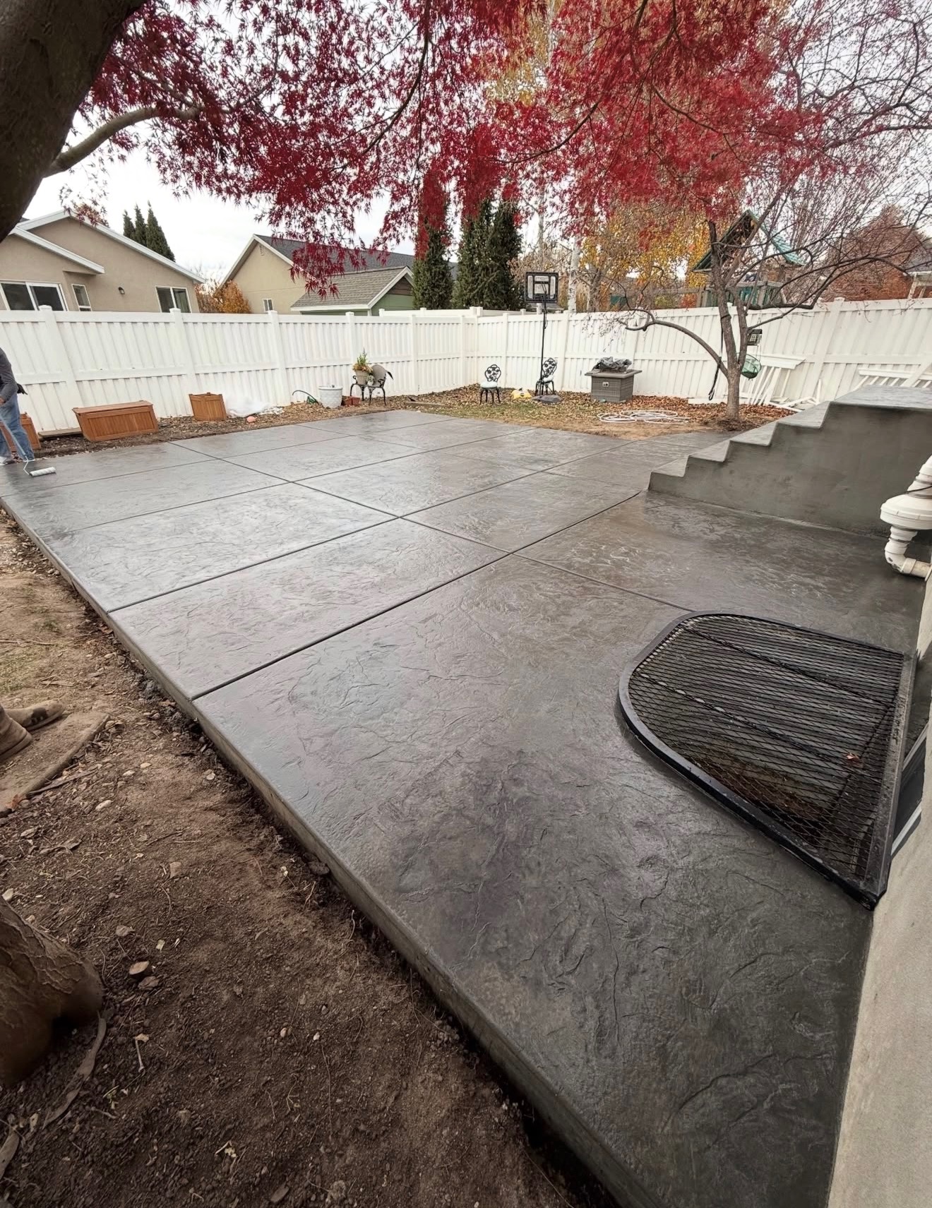 Stamped concrete patio with fire pit cutout