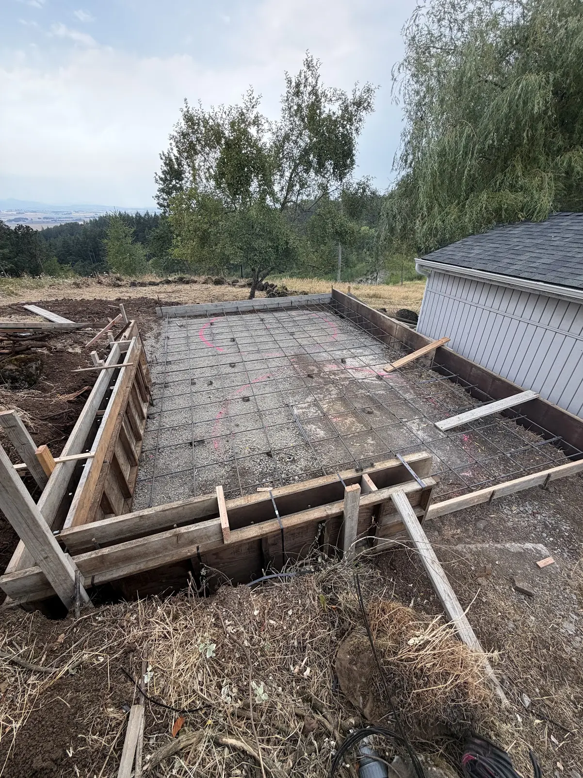 Concrete foundation prep with rebar and forms in Salem, Oregon